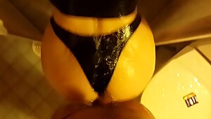 Me fucking my wife'_s big wet ass in latex strings in shower